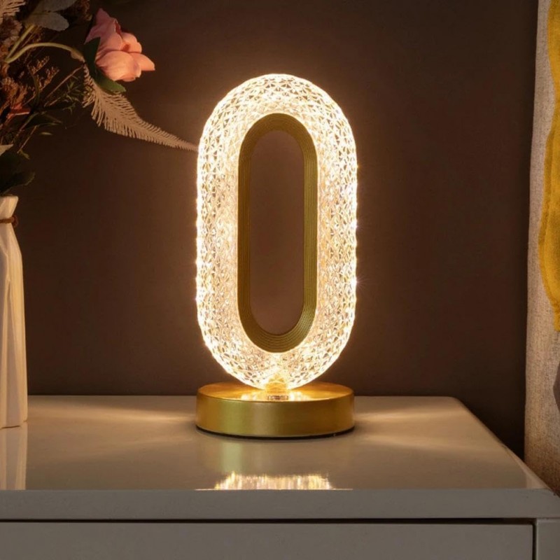 Une lampe de table LED merveilleusement conçue avec trois niveaux de couleurs pour l'éclairage nocturne de la chambre. Un design